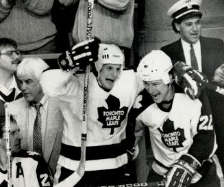 Bring on the Wings!: Canadian Olympian Ken Yaremchuk, left and much-travelled Mike Blaisdell whoop it up after the Leafs roared back to beat the Wings on Saturday night