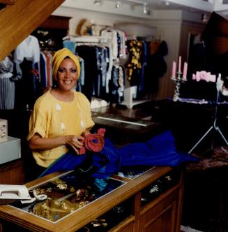 Fiti Yousif sews extra touches on designer fashions she sells at Fetoun on Scollard St