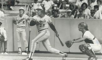 Minnesota Twins' Dave Edwards watches his grand slam home run head for leftfield stands in third inning