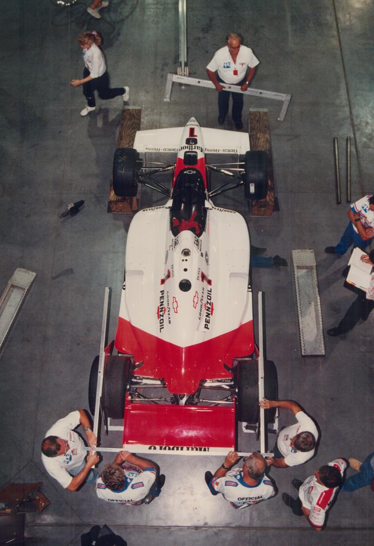 Last-minute tuning: The CNE Automotive Building was a hive of activity yesterday as crews readied for today's opener of qualifying for Sunday's fifth Molson Indy