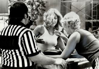 Dianne Tatti (left) and Edna Howie face off in Canadian Armswrestling Championships