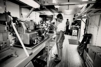 Rolling Tech: Quaker State Porsche's Robert Holt in his office (above) and mobile workshop (top)