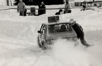 Slip-slidin' away: One driver (right) is well bundled against the cold in his airy seat