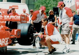 Tire check: An indy car gets a going over during a promotion at the TD Centre yesterday