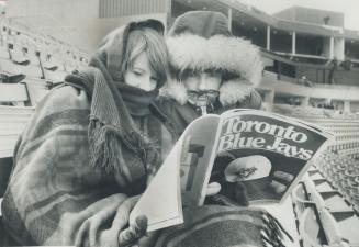 Snuggled warmly in blankets and pakas, Blue Jays fans Janet Gunn (left), 16, and Alexandra Julian, 13, of North York, got to their seats at Exhibition(...)