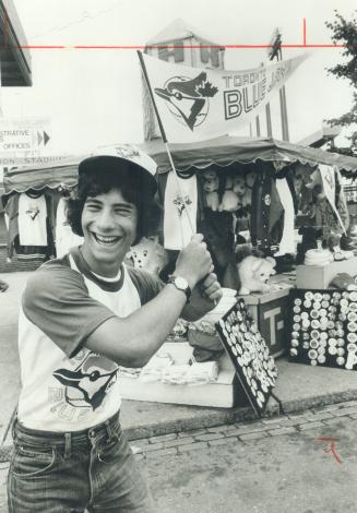 Blue Jay specialist Joe Ferorelli, 17, of Agincourt, at his stand at the Exhibition, is part of the Blue Jay 'phenomenon.' Blue Jay specialties, figur(...)