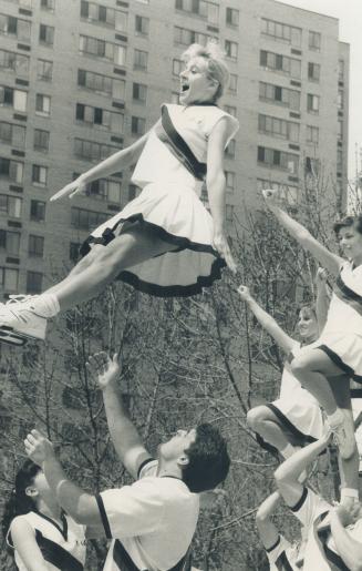 Flying high: Cheerleaders for Erindale Raiders perform at Harbourfront yesterday and demonstrate there's more to it than just jumping around and chanting