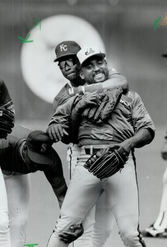 Havin' fun: Danny Tartabull of the Royals puts Ivan Calderon in headlock yesterday at the dome