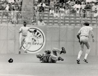 Tumbling ump hits the deck. Umpiring crew chief Joe Brinkman got a wakeup call from 180-pound Ranger second baseman Jeff Kunkel yesterday. Kunkel blin(...)