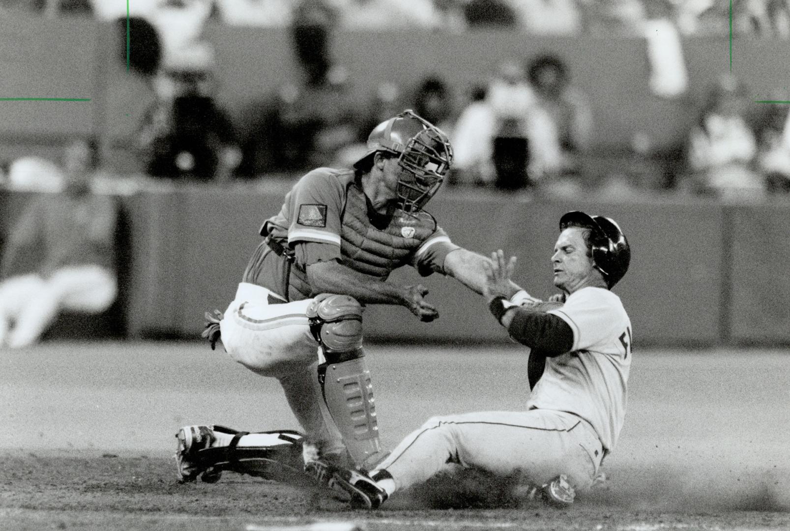 On the mark: Jays' catcher Randy Knorr tags Boston second baseman Scott Fletcher out at the plate on a throw from outfielder Shawn Green last night