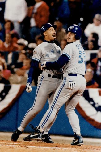 Unlikey heores, Derek Bell and sprague, celebrate at the plate after the big two-run blast