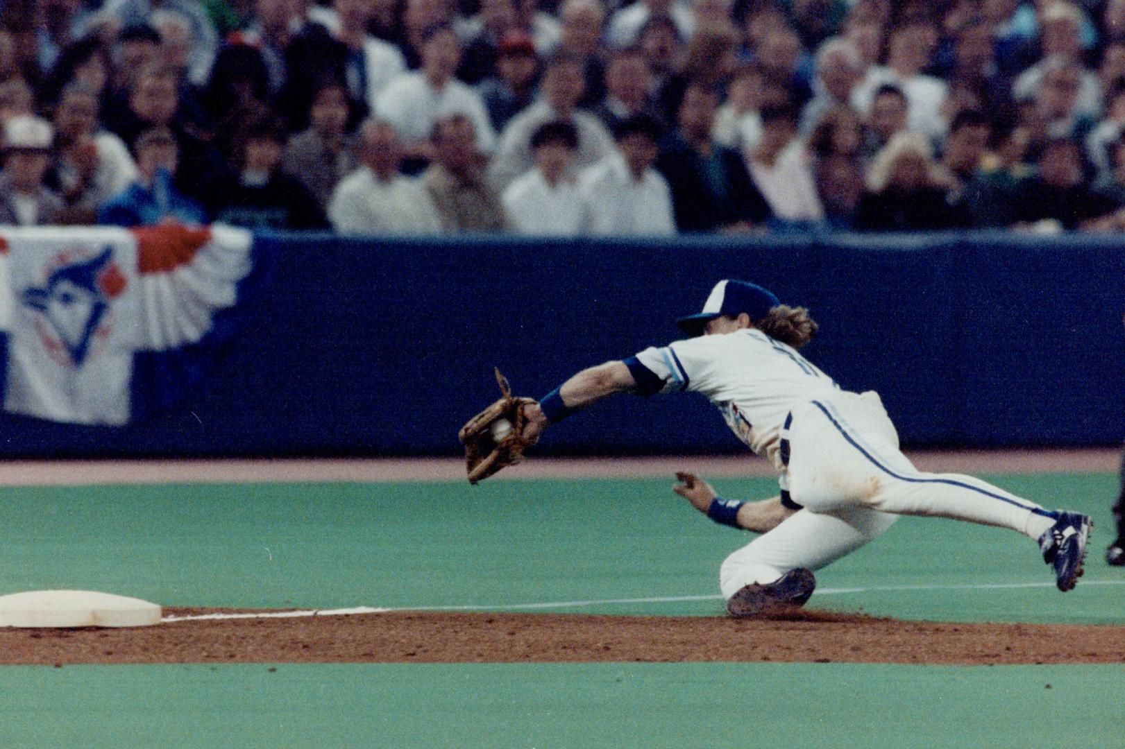 Gold Glove Grab. Kelly Gruber shows he's still great in the field if not at the plate