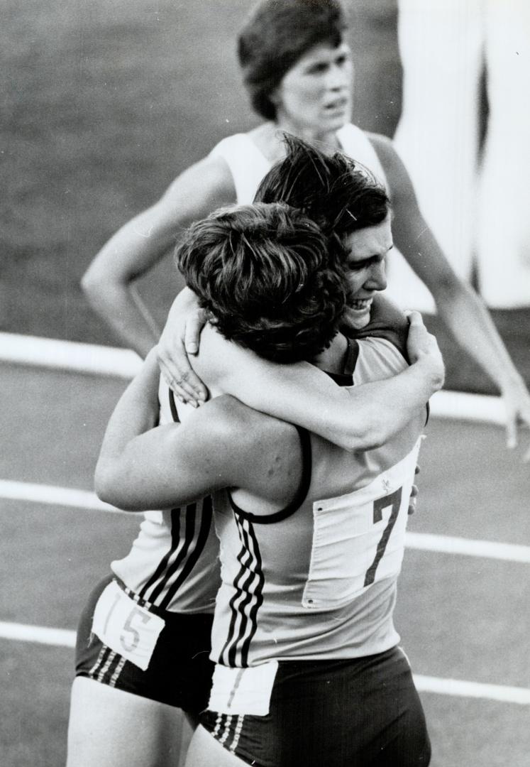 Edmonton. Aug 10th. Tears of joy. Judith Peckham (15) of Australia was so happy when she won the 800 metres final she fell into the arms of teammate B(...)