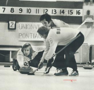 Winning skip Bob Charlebois concentrates on delivery