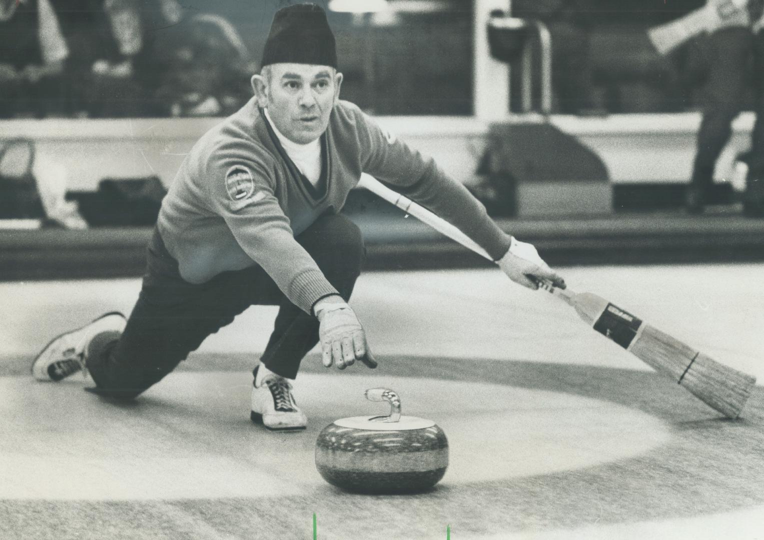 Showing a fine sense of Balance, Stu Wheler of Tam Heather releases rock during Imperial Life mixed bonspeil match with Royal Canadians' Ross Dann las(...)