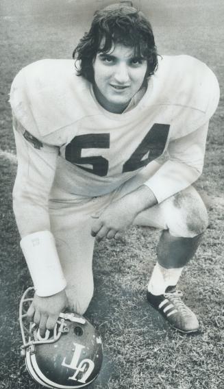 Angelo Castellan, pausing for rest during Varsity Blues' workout yesterday, took year off from football but has made the starting line-up in his first attempt