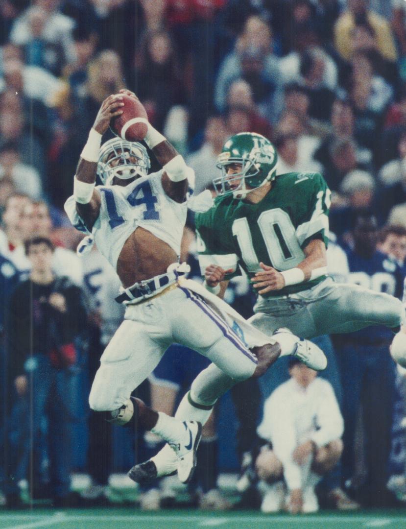 Interception: Western's Darryl Forde steps in front of Saskatchewan's Dan Farthing to pick off pass in Vanier Cup