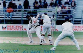 Pakistan's Wasim AKram (left)