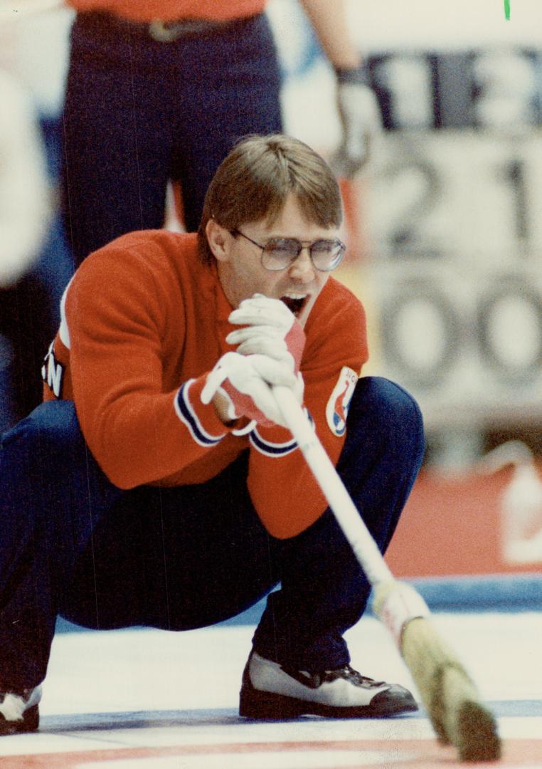 Talking a good game. When you're curling, body English helps, and so does talking the shot along. That's Canada's third, John Ferguson at left, Norweg(...)