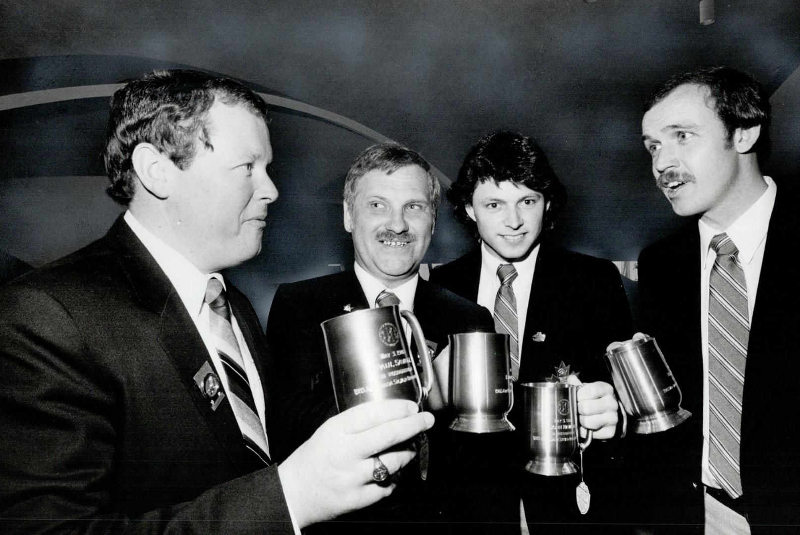 Cheers for the champs. Members of Canada's world championship curling rink (left to right) Paul Savage, Ed Werenich, John Kawaja and Neil Harrison, to(...)