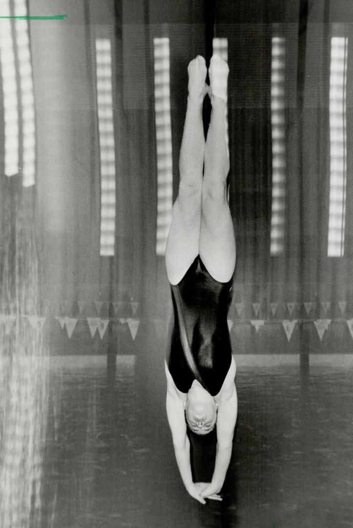 Taking the plunge: Diver Laurie Nelson, 12 , lines up for a perfect entry into the water at Etobicoke Olympium