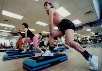 The latest theme in the club scene is step classes using a rectangular platform, national aerobics champion, Sheryl Fieldstone, right, leads a step class at the Dunfield Club