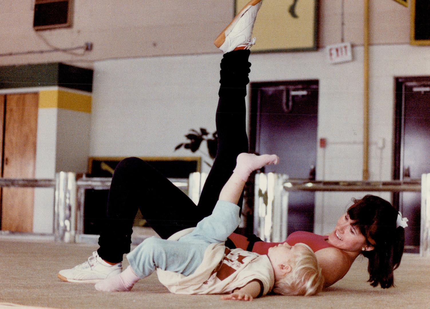 Stretch, baby, stretch! Instructor Tracy Lennox, 20, helps 2-year-old Christian Buchert prepare for the Muscular Dystrophy Association of Canada's Aer(...)