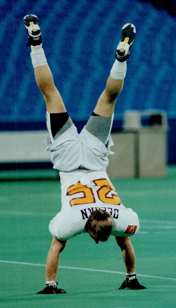 Walk: Mount Allison kicker Eric Deegan demonstrates warming up on the SkyDome turf at practice yesterday