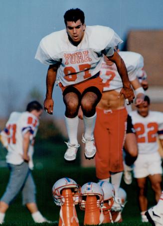 Jumping on York's bandwagon. Members of the York Yeomen football team, including Nat Silviera in the foreground, jump pylons to prepare for their big (...)