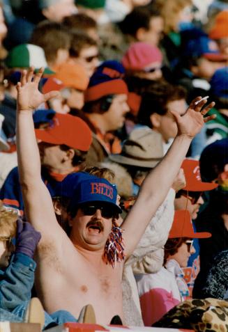 Bills boosters come in many shapes and sizes and under varying layers of clothing (at top), to cheer on quarterback Jim Kelly (above, taking a snap fr(...)