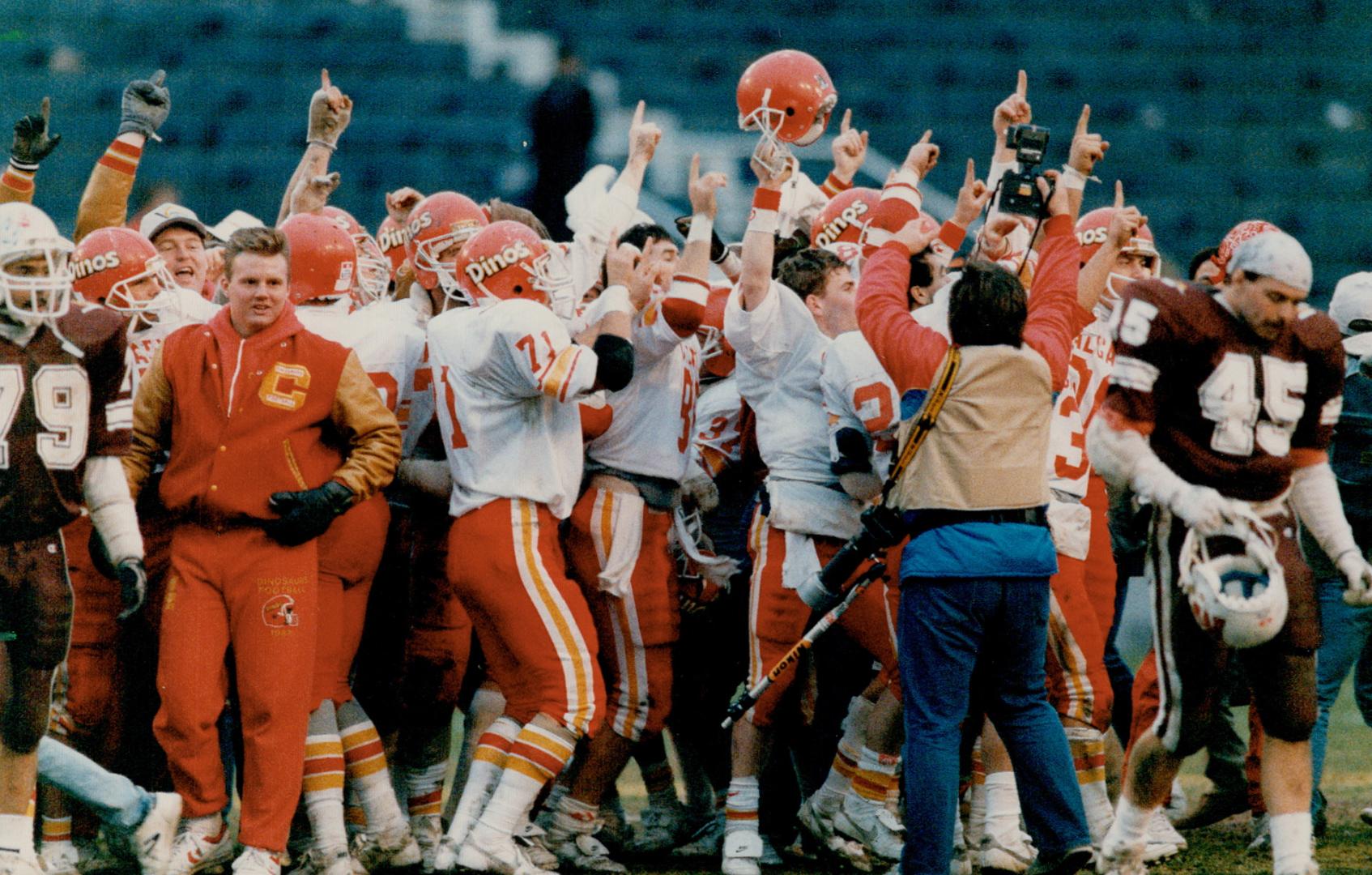 Football's finest: The hungry University of Calgary Dinosaurs rumbled into Varsity Stadium and grabbed a fistful of grid glory yesterday