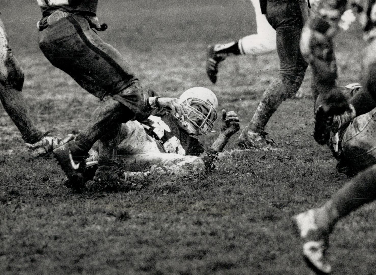 Richview and Etobicoke senior football teams had to contend with rain, snow and a quagmire during yesterday's City of Etobicoke final - won by Richview