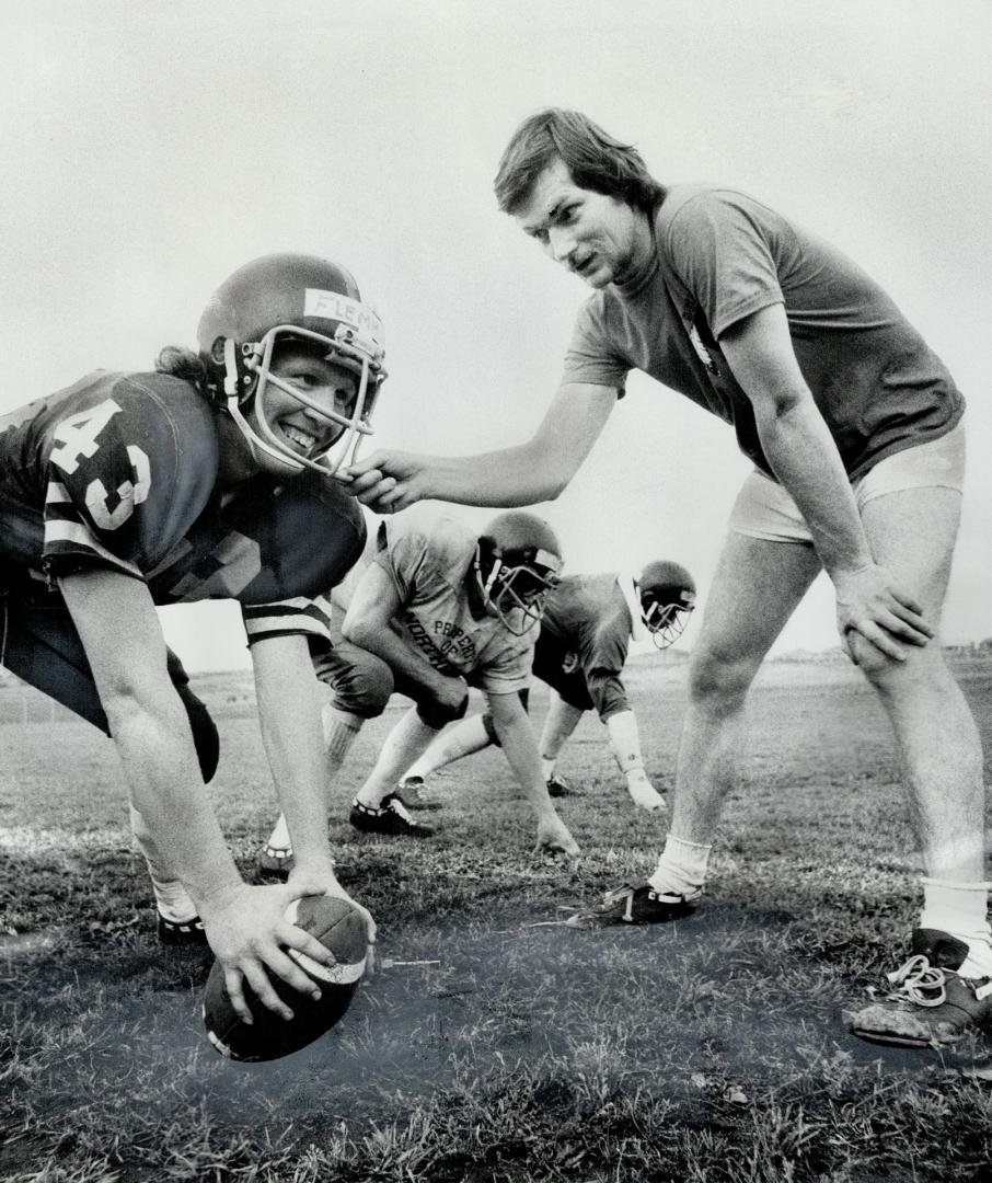 Football coach Craig Williamson, right, has feamed up a course to teach women what the game is about