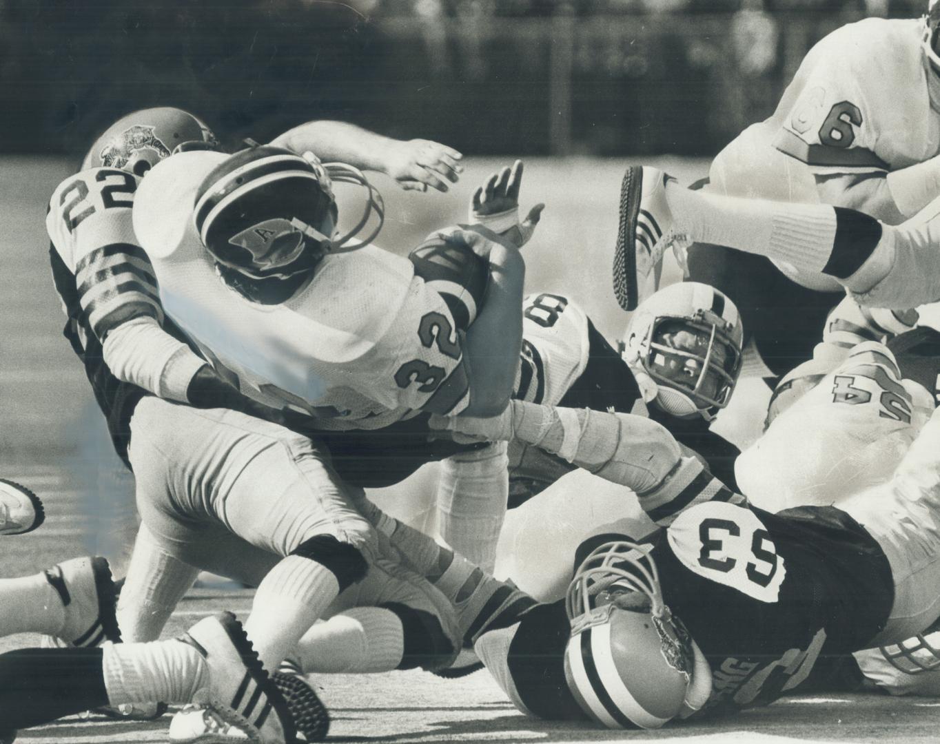 Argo Fullback Neil Lumsden crashes through Hamilton Tiger-Cat line in traditional Thanksgiving Day match