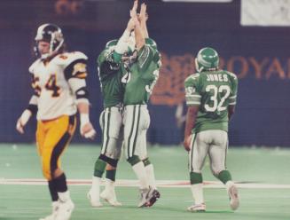 Big Moment: Placekicker Dave Ridgeway and his holder, Glen Suitor, celebrate the winning field goal