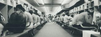 Players assemble for 9:30 a.m. workout, first of two of the day. With about 80 players, dressing room at Alumni Stadium training site is a mighty busy place