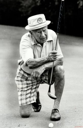 Still playing: 87-year-old Harry Kennedy, setting up a putt yesterday at Rosedale, is oldest player in seniors' tournament