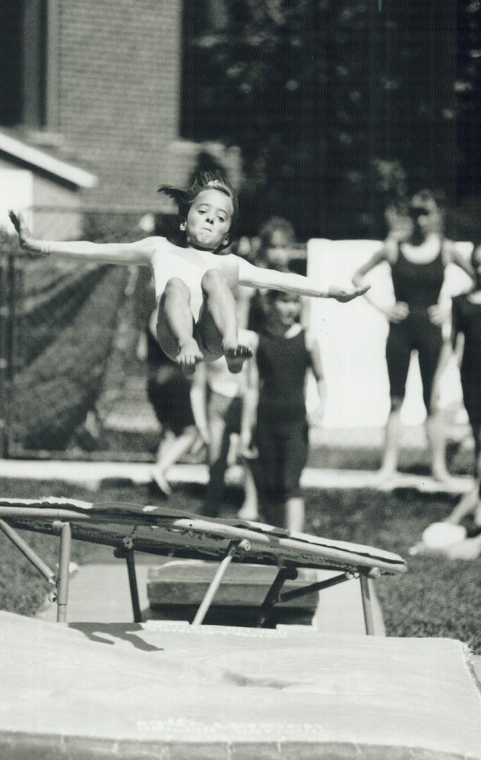 Airborne Imp: A wee member of the Gyros Gymnastic Club performs a routine at a barbecue yesterday in North York in honor of Liberal MP Joseph Volpe