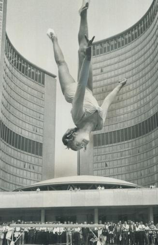 Don't panic. Teresa McDonnell hasn't jumped off top of City Hall. This was part of gymnastic display put on by Canada's top gymnasts in sweltering hea(...)