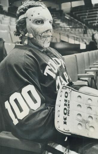 Finnish goaltender Jorma Valtonen watches from seats at yesterday's Maple Leaf training session