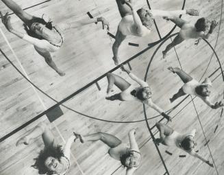 Performing a kick-jump routine are eight members of the Canadian modern gymnastics team as they practiced last night at the Glenview Public School gym(...)