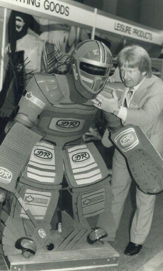 The goalie of the year 2025, Ex-hockey star Pat Stapleton checks out a futuristic goalie at the Canadian Tire suppliers trade show at Exhibition Place(...)