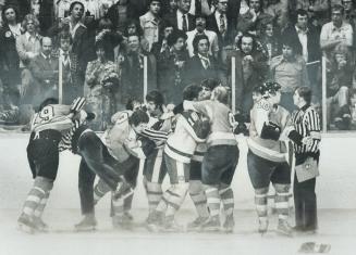 Flyers, leafs tangle in one of many brawls during Thursday night's game at gardens, On left, linesman wrestles with Flyers' Jack McIlhargey, at right, Flyers' Mel Bridgman argues with ref