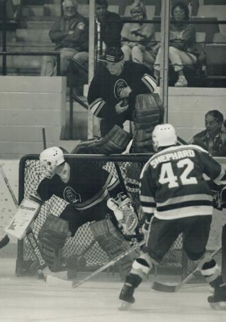 Heavenly Hijinks: Scenes like this are common when the famous Flying Fathers take to the ice for one of their fundraising games