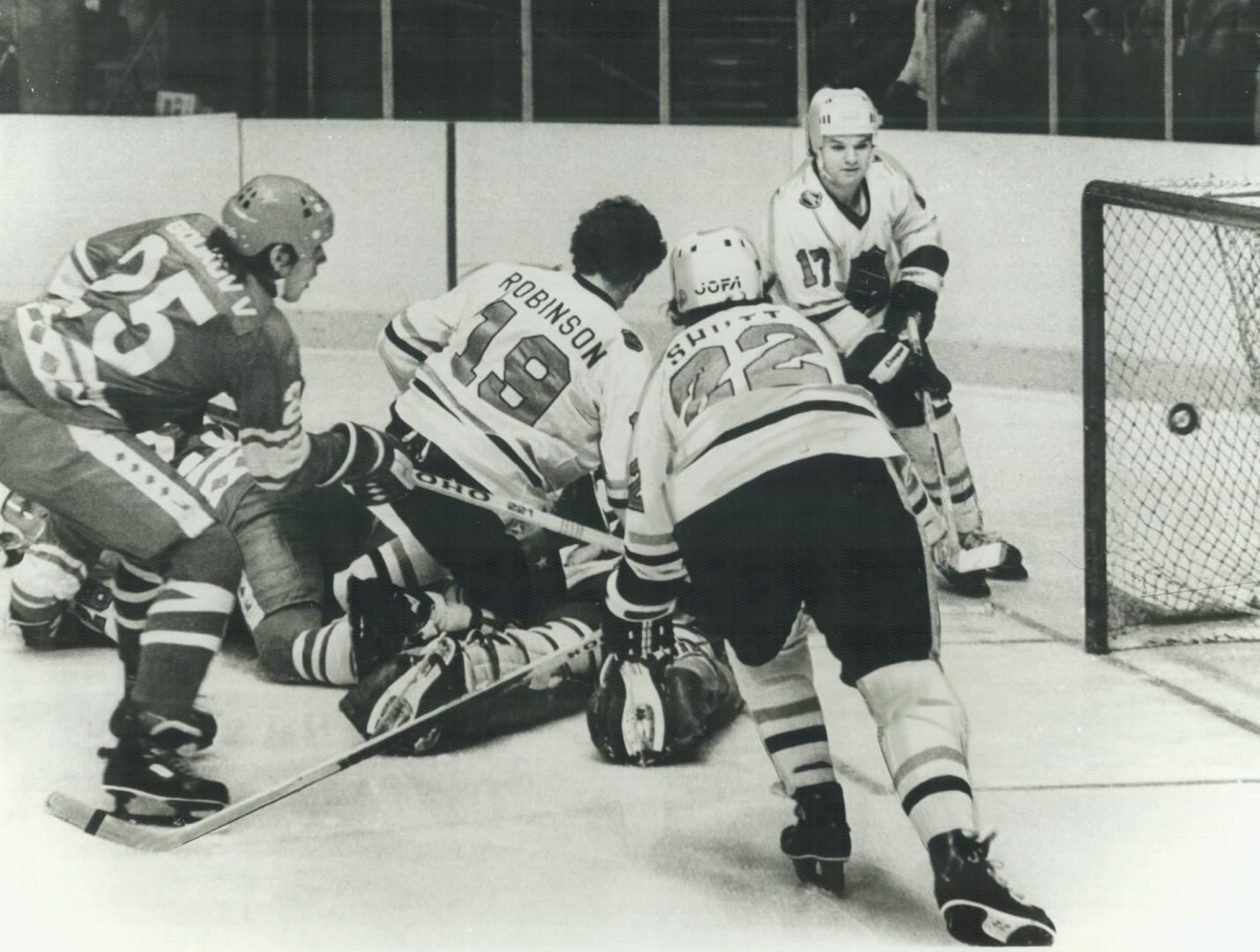 Vladimir Golikov scores second Soviet goal, lifting puck over Ken Dryden