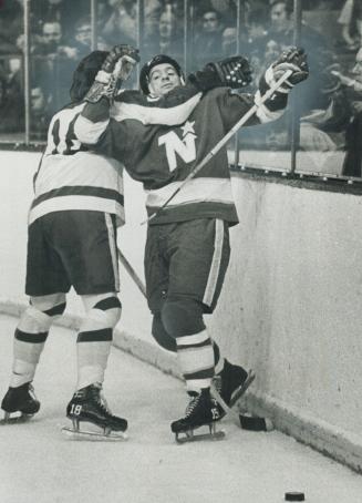 Whipper Billy Watson, Couldn't have done better than Leafs' Jim McKenny (18) did on this play, stopping (!) Bobby Rousseau of North Stars. However, ho(...)