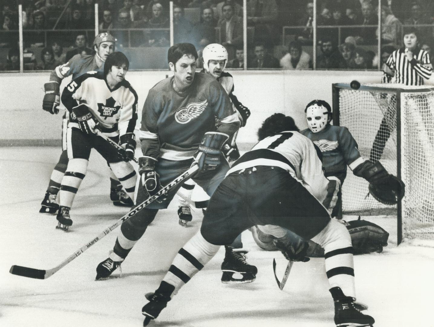 Leafs' Darryl Sittler bounces puck off crossbar with goalkeeper Jim Rutherford beaten on the play