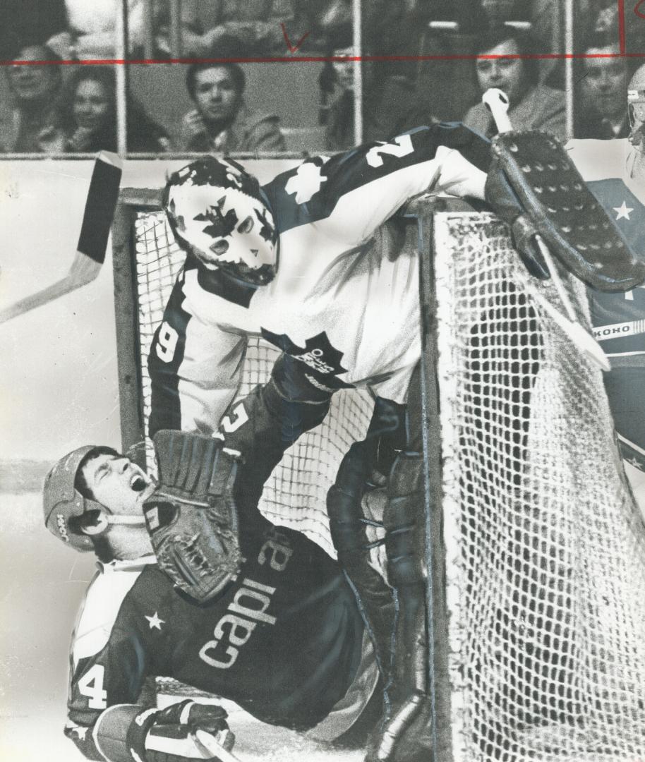 Despite look of agony, Caps' Robert Picard wasn't hurt when he slid past Mike Palmateer into Leaf net