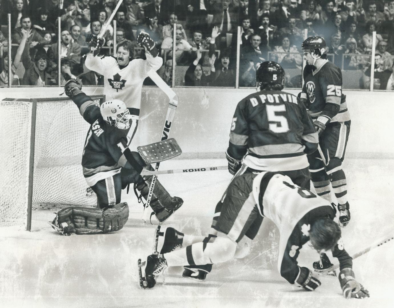 Agony And Ecstacy? Leafs and their fans celebrate Lanny McDonald's goal in first period, but Jack Valiquette (8) crumples to the ice after taking a hi(...)