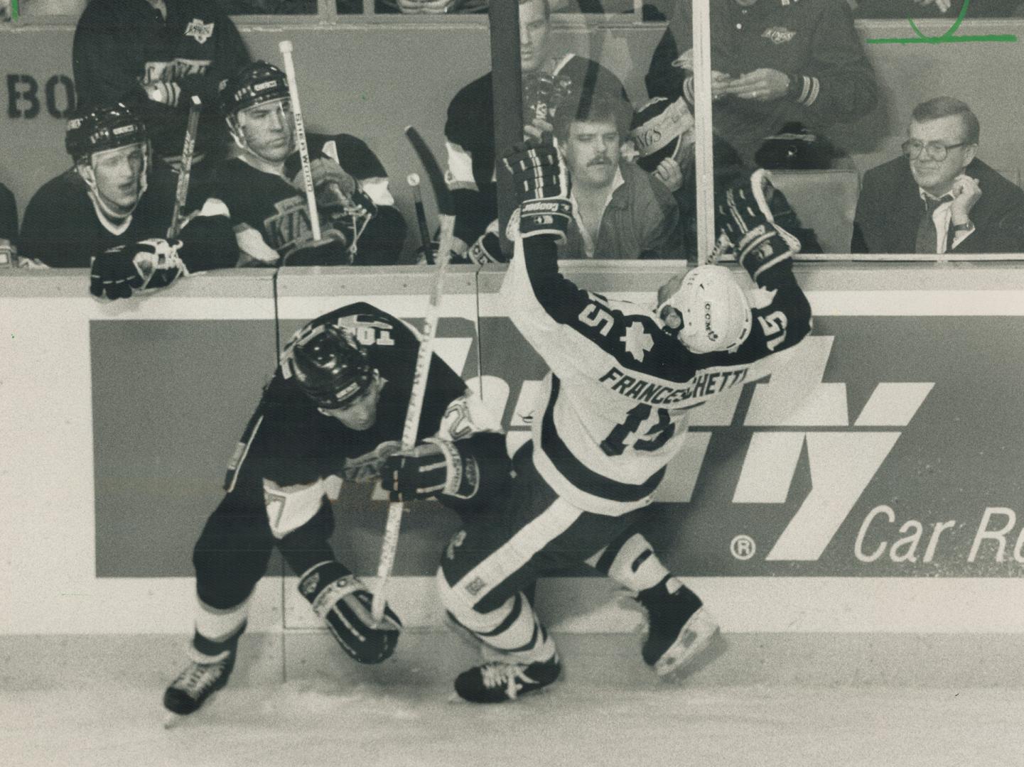 Look out, Lou! Truculent Toronto winger Lou Franceschetti for a fall courtesy of Kings grinder John Tonell last night at Maple Leaf Gardens. Lou got u(...)